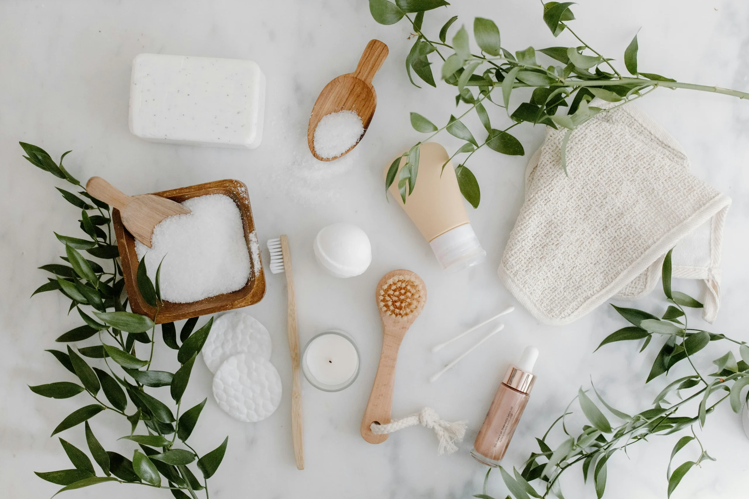 Flat lay of natural skincare ingredients and tools for glowing skin