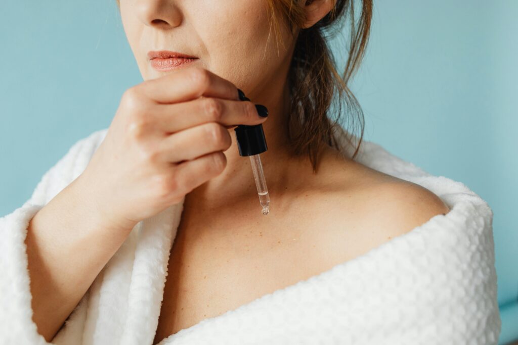 woman applying serum — advanced body care trends 2026
